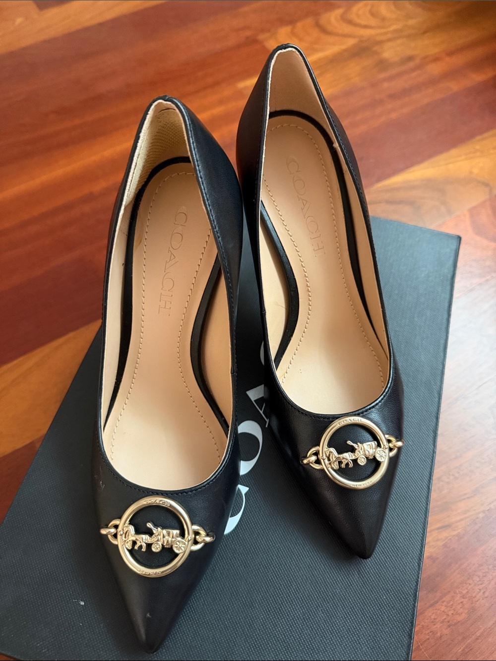 Coach Black Leather Pointed Pumps with Gold Signature Medallion